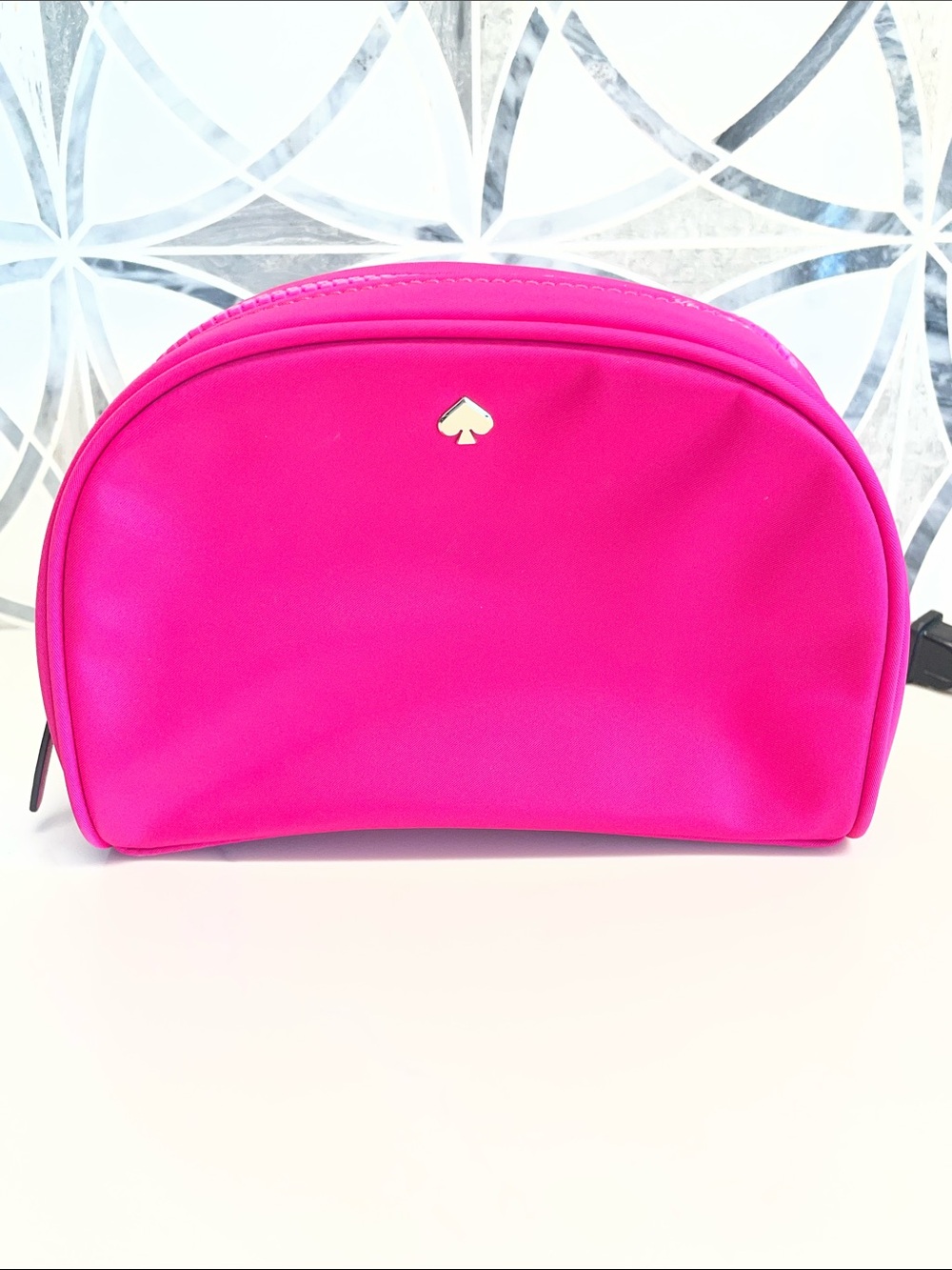 NWOT bright pink Kate Spade zip makeup bag.
